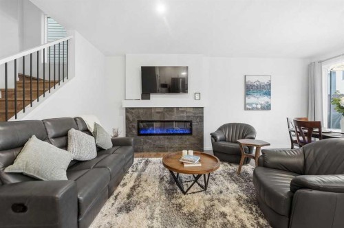 102 Setonstone Manor Se, Calgary, AB - Indoor Photo Showing Living Room With Fireplace