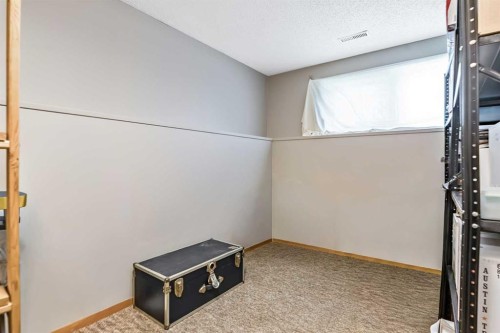 323 Woodvale Crescent Sw, Calgary, AB - Indoor Photo Showing Other Room