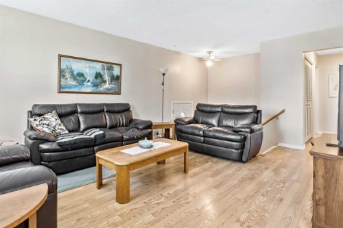 323 Woodvale Crescent Sw, Calgary, AB - Indoor Photo Showing Living Room