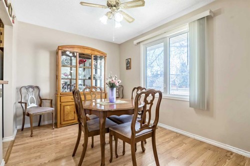 323 Woodvale Crescent Sw, Calgary, AB - Indoor Photo Showing Dining Room