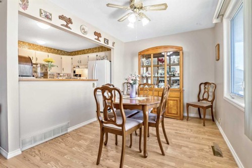 323 Woodvale Crescent Sw, Calgary, AB - Indoor Photo Showing Dining Room