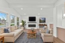 212 Queen Anne Road Se, Calgary, AB  - Indoor Photo Showing Living Room With Fireplace 