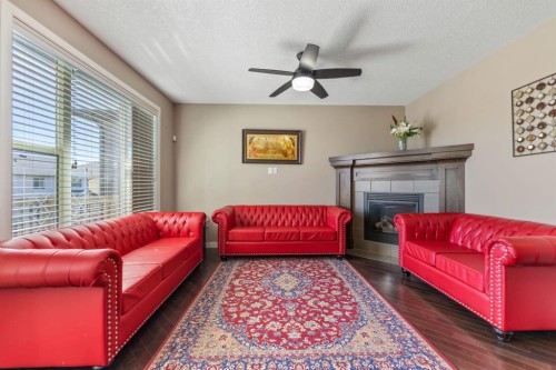 130 Brightonwoods Grove Se, Calgary, AB - Indoor Photo Showing Living Room With Fireplace