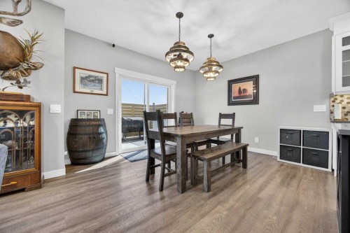 10 Bishop Circle, Carstairs, AB - Indoor Photo Showing Dining Room With Fireplace