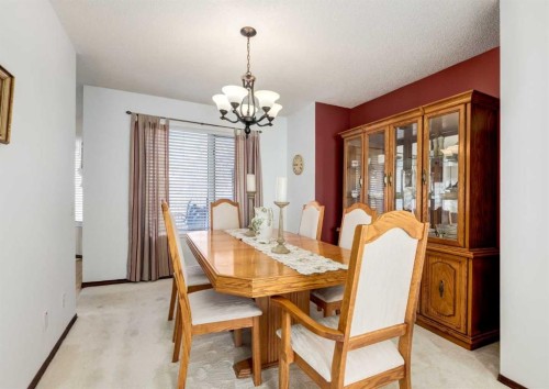 83 Gleneagles Close, Cochrane, AB - Indoor Photo Showing Dining Room