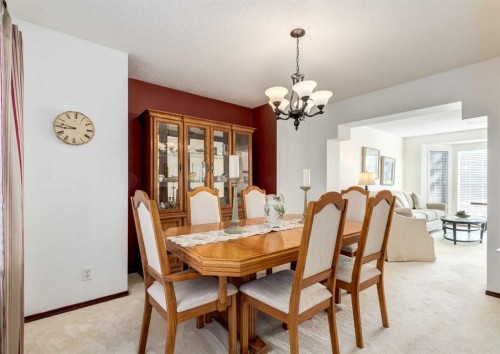 83 Gleneagles Close, Cochrane, AB - Indoor Photo Showing Dining Room