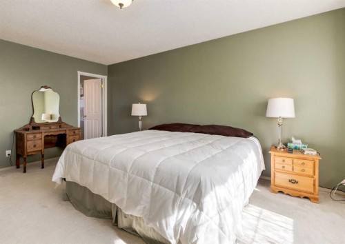 83 Gleneagles Close, Cochrane, AB - Indoor Photo Showing Bedroom