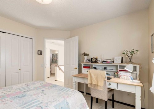 83 Gleneagles Close, Cochrane, AB - Indoor Photo Showing Bedroom
