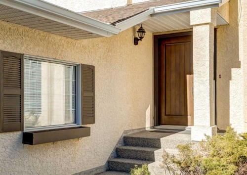 83 Gleneagles Close, Cochrane, AB - Outdoor With Exterior