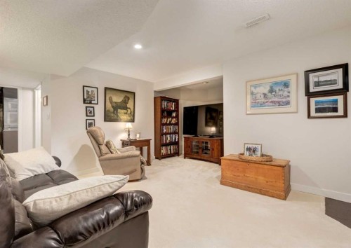 83 Gleneagles Close, Cochrane, AB - Indoor Photo Showing Living Room
