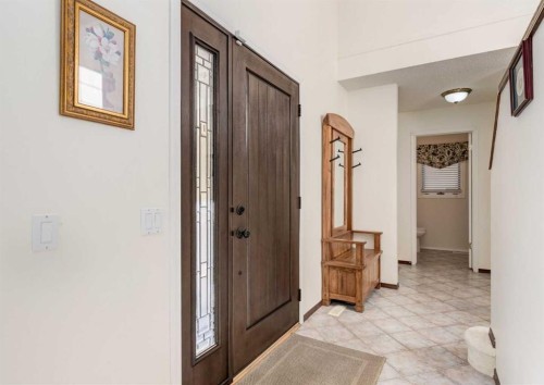 83 Gleneagles Close, Cochrane, AB - Indoor Photo Showing Other Room
