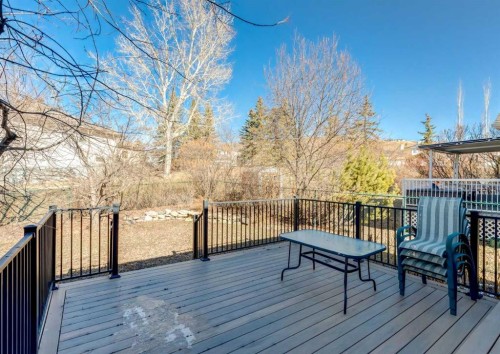 83 Gleneagles Close, Cochrane, AB - Outdoor With Deck Patio Veranda