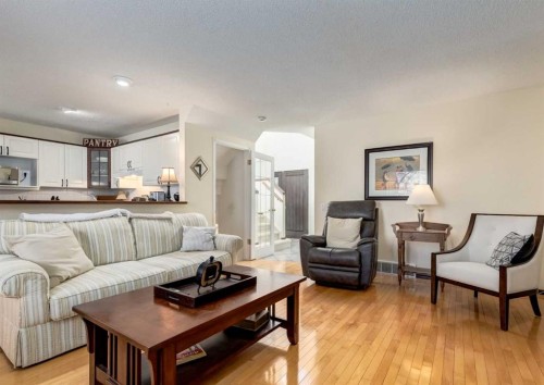 83 Gleneagles Close, Cochrane, AB - Indoor Photo Showing Living Room