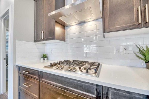 9 Mist Mountain Rise, Okotoks, AB - Indoor Photo Showing Kitchen With Upgraded Kitchen