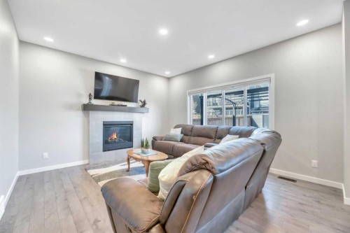 9 Mist Mountain Rise, Okotoks, AB - Indoor Photo Showing Living Room With Fireplace