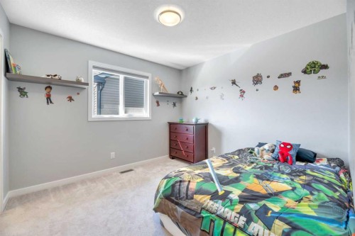 9 Mist Mountain Rise, Okotoks, AB - Indoor Photo Showing Bedroom