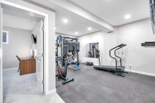 9 Mist Mountain Rise, Okotoks, AB - Indoor Photo Showing Gym Room