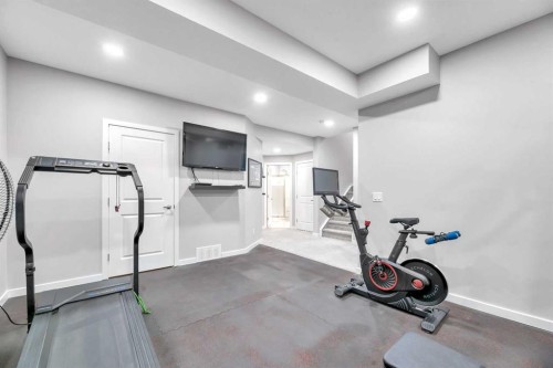 9 Mist Mountain Rise, Okotoks, AB - Indoor Photo Showing Gym Room