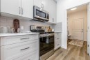 432 Rivercrest Road, Cochrane, AB  - Indoor Photo Showing Kitchen With Upgraded Kitchen 