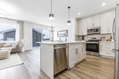 432 Rivercrest Road, Cochrane, AB - Indoor Photo Showing Kitchen With Stainless Steel Kitchen With Upgraded Kitchen