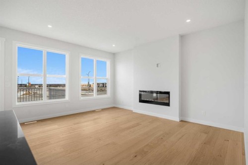192 Belmont Place Sw, Calgary, AB - Indoor Photo Showing Living Room With Fireplace