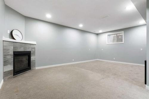 51 Sage Bank Court Nw, Calgary, AB - Indoor Photo Showing Other Room With Fireplace