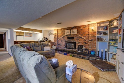 5338 5 Street West, Claresholm, AB - Indoor Photo Showing Living Room With Fireplace