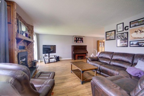 5338 5 Street West, Claresholm, AB - Indoor Photo Showing Living Room With Fireplace