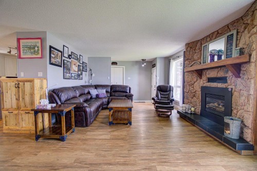 5338 5 Street West, Claresholm, AB - Indoor Photo Showing Living Room With Fireplace