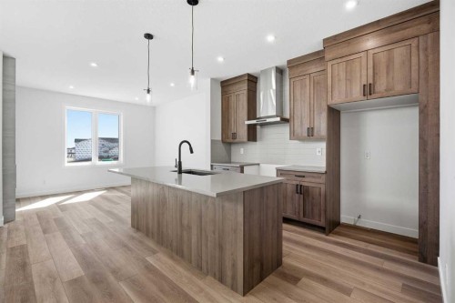 201 Bridgeport Gate, Chestermere, AB - Indoor Photo Showing Kitchen With Upgraded Kitchen