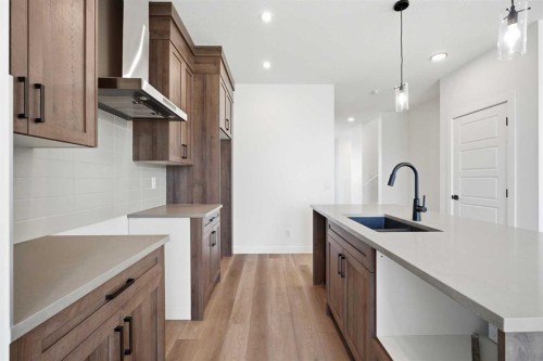 201 Bridgeport Gate, Chestermere, AB - Indoor Photo Showing Kitchen With Upgraded Kitchen