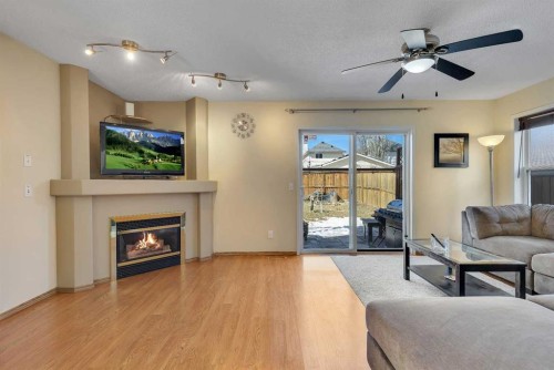 6 Covewood Park Ne, Calgary, AB - Indoor Photo Showing Living Room With Fireplace