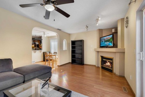 6 Covewood Park Ne, Calgary, AB - Indoor Photo Showing Living Room With Fireplace