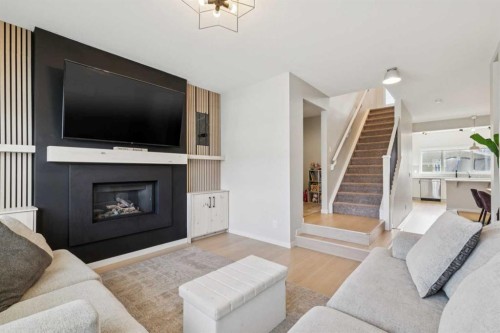 325 Marquis Heights Se, Calgary, AB - Indoor Photo Showing Living Room With Fireplace
