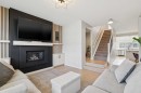 325 Marquis Heights Se, Calgary, AB  - Indoor Photo Showing Living Room With Fireplace 