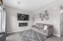811-250 Fireside View, Cochrane, AB  - Indoor Photo Showing Living Room With Fireplace 