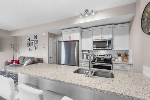 811-250 Fireside View, Cochrane, AB - Indoor Photo Showing Kitchen With Stainless Steel Kitchen With Double Sink With Upgraded Kitchen