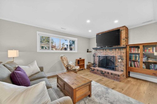 8927 48 Avenue Nw, Calgary, AB - Indoor Photo Showing Living Room With Fireplace