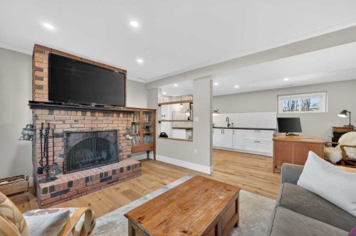 8927 48 Avenue Nw, Calgary, AB - Indoor Photo Showing Living Room With Fireplace