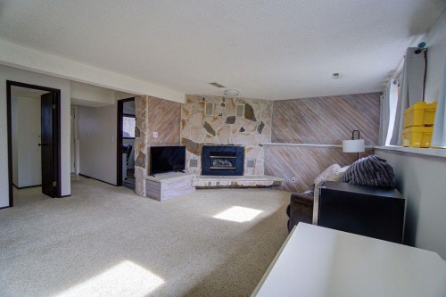 47 Willow Road, Claresholm, AB - Indoor With Fireplace