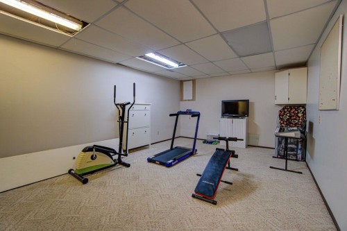 47 Willow Road, Claresholm, AB - Indoor Photo Showing Gym Room