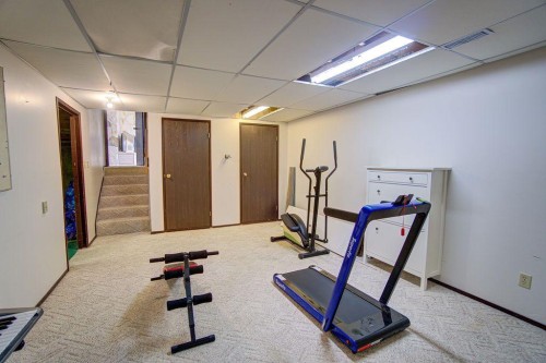 47 Willow Road, Claresholm, AB - Indoor Photo Showing Gym Room