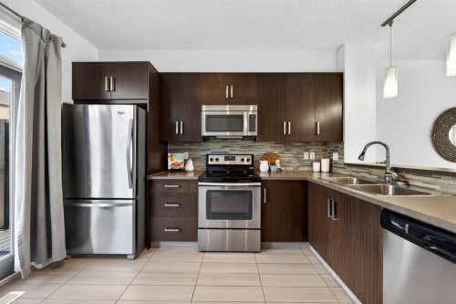 8 Walden Walk Se, Calgary, AB - Indoor Photo Showing Kitchen With Double Sink