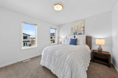 8 Walden Walk Se, Calgary, AB - Indoor Photo Showing Bedroom