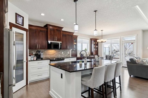 101 Sheep River Crest, Okotoks, AB - Indoor Photo Showing Kitchen With Upgraded Kitchen