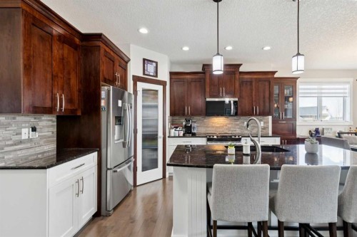101 Sheep River Crest, Okotoks, AB - Indoor Photo Showing Kitchen With Upgraded Kitchen