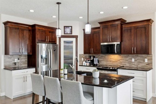 101 Sheep River Crest, Okotoks, AB - Indoor Photo Showing Kitchen With Upgraded Kitchen