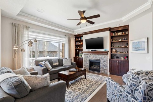 101 Sheep River Crest, Okotoks, AB - Indoor Photo Showing Living Room With Fireplace