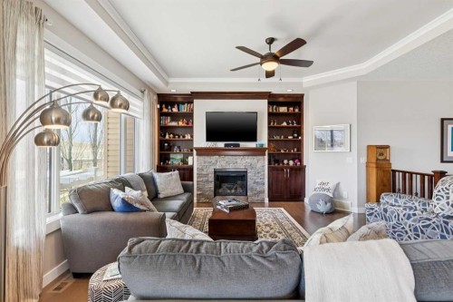 101 Sheep River Crest, Okotoks, AB - Indoor Photo Showing Living Room With Fireplace