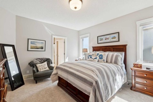 101 Sheep River Crest, Okotoks, AB - Indoor Photo Showing Bedroom